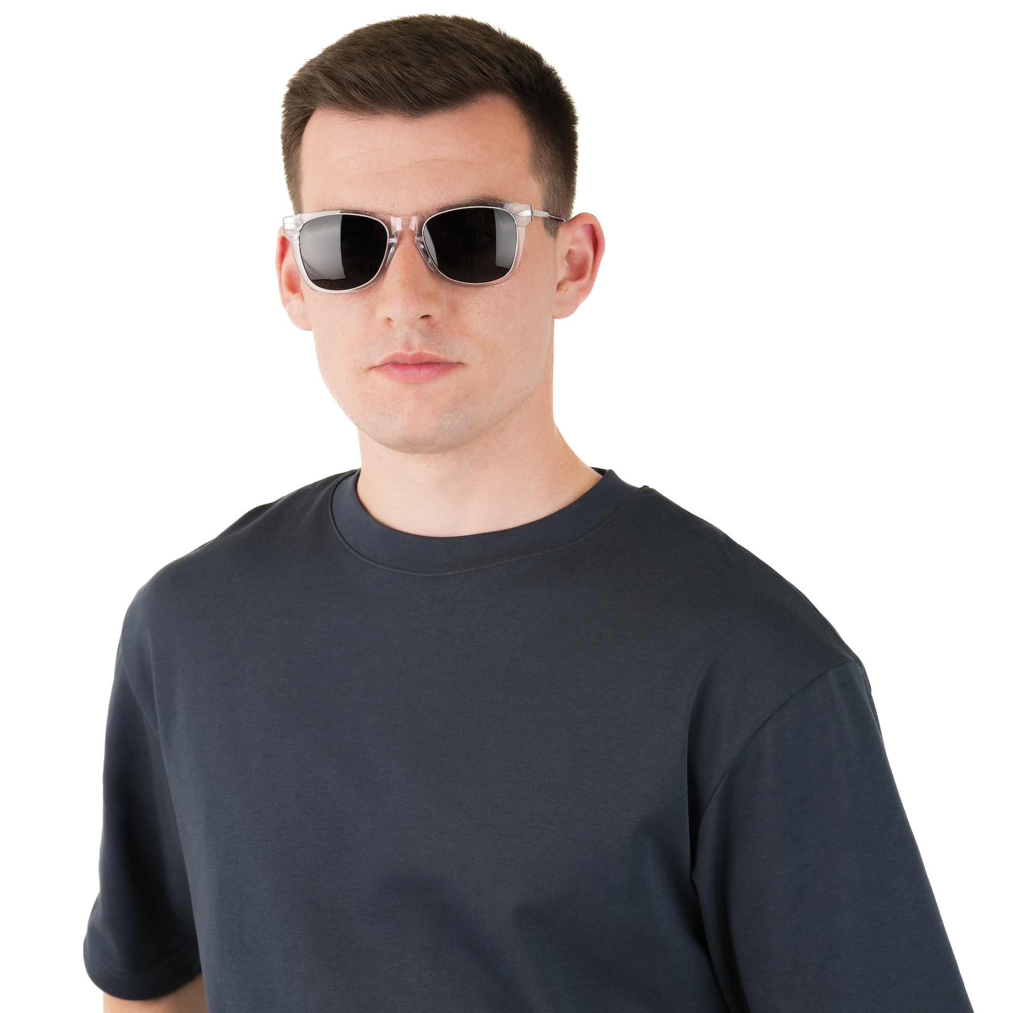 A man wearing a dark charcoal gray t-shirt and square sunglasses, photographed against a solid white background.