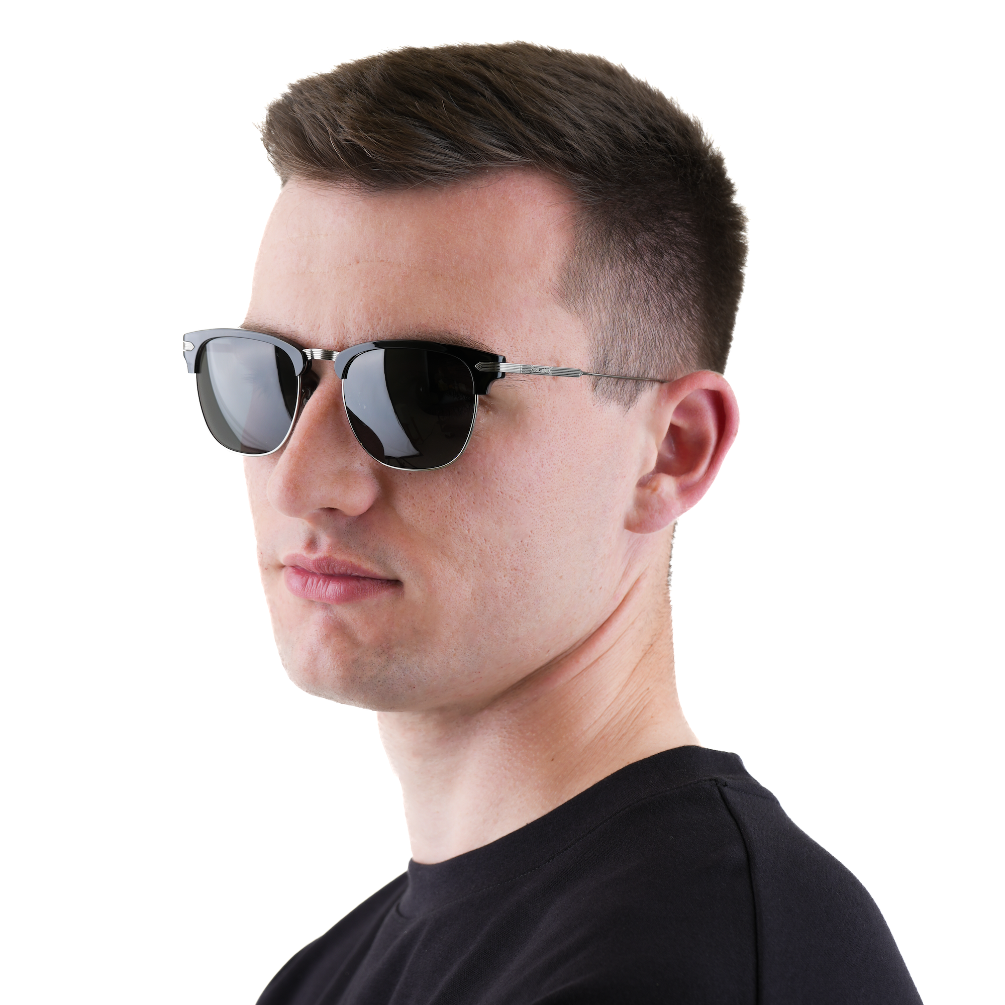 A man in profile wearing classic aviator-style sunglasses with dark lenses and thin metal frames, set against a plain white background.