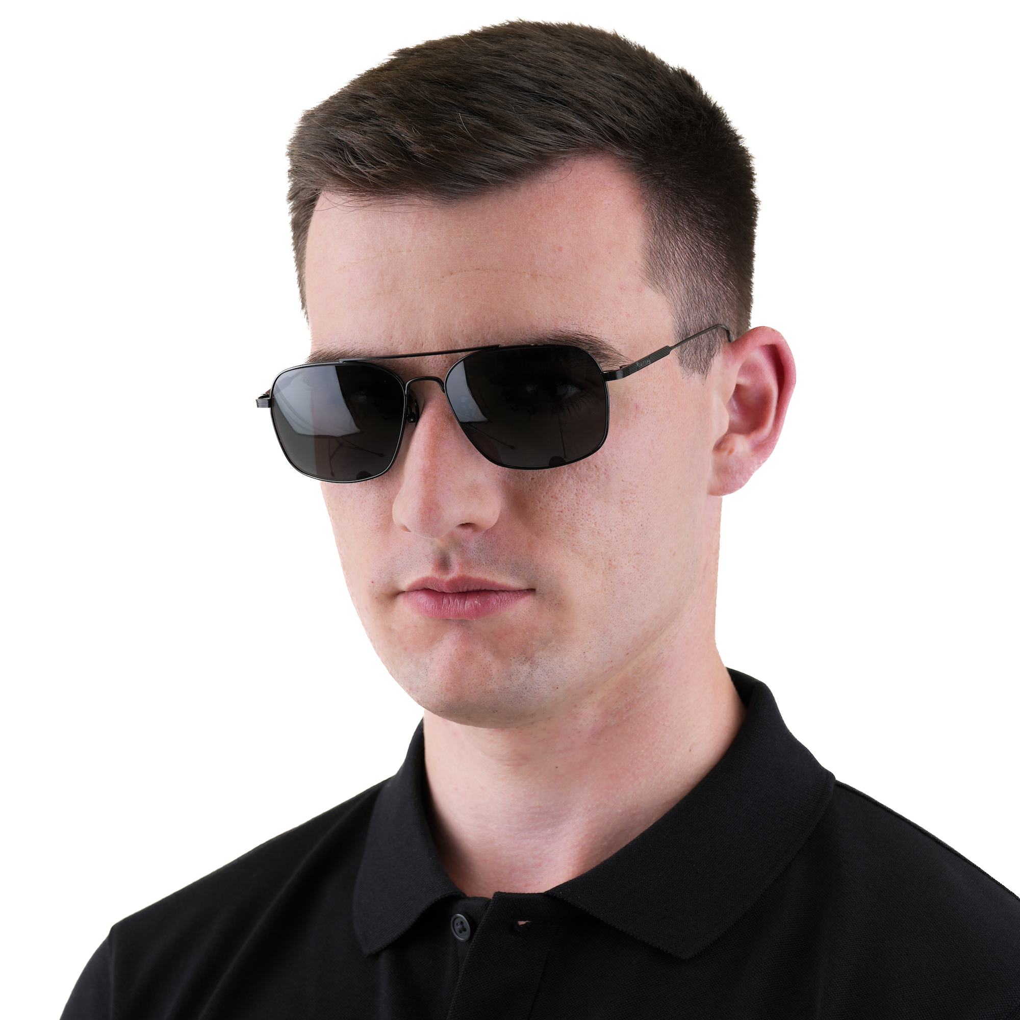 A man wearing black aviator sunglasses and a black polo shirt, photographed against a solid white background.