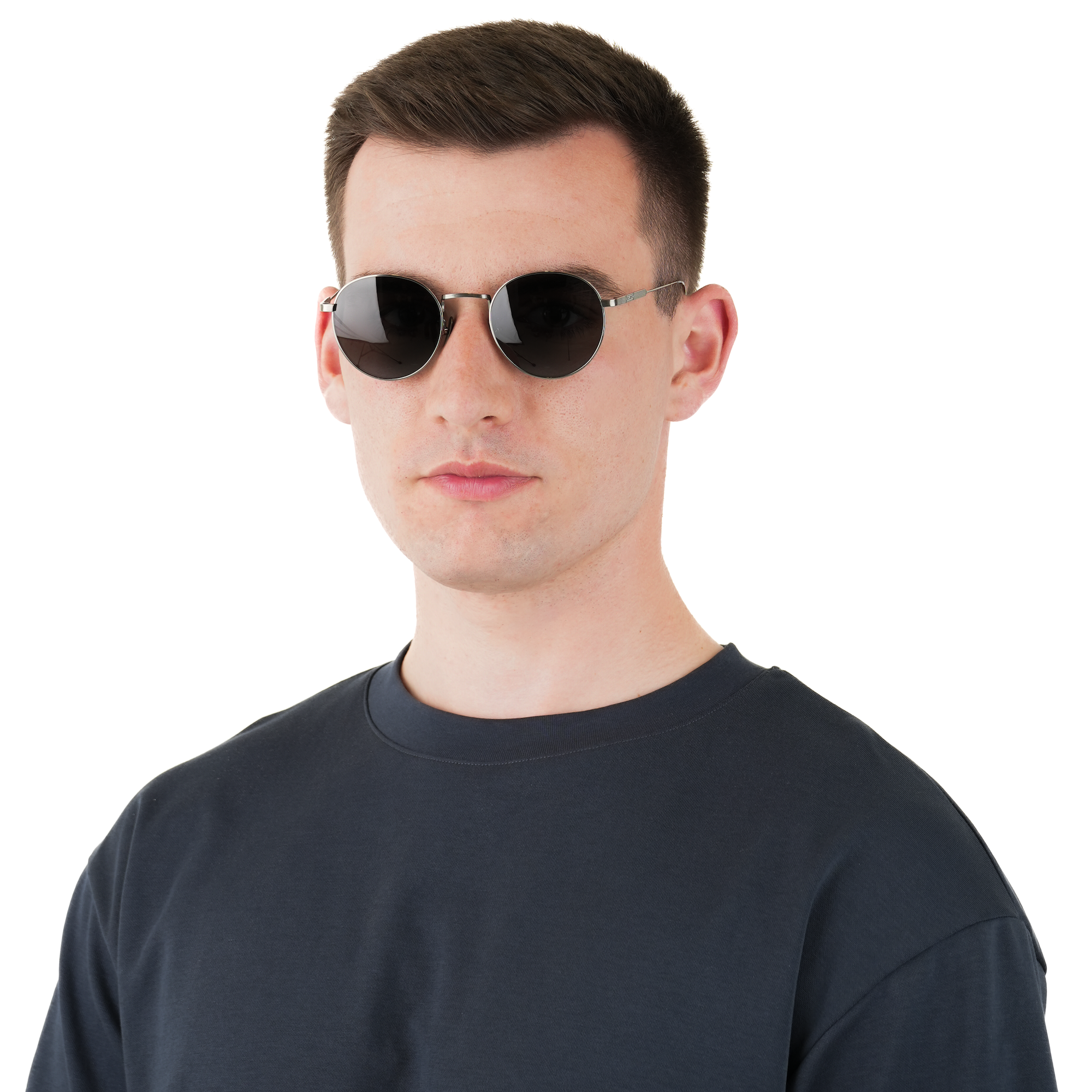 A man wearing round black sunglasses with thin gold metal frames and a dark navy long-sleeve shirt, photographed against a solid white background.