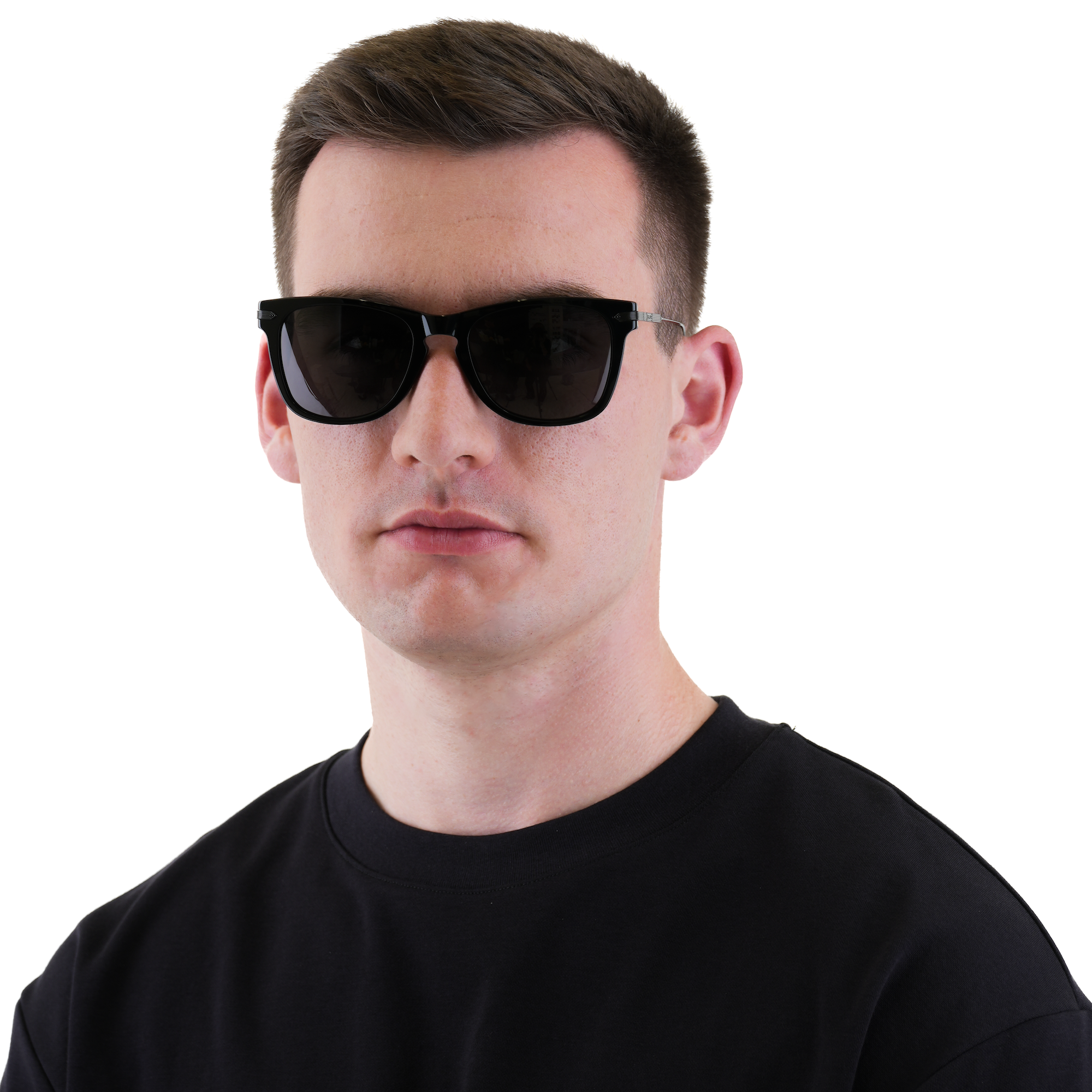 A man wearing black sunglasses and a black t-shirt, photographed against a solid white background.