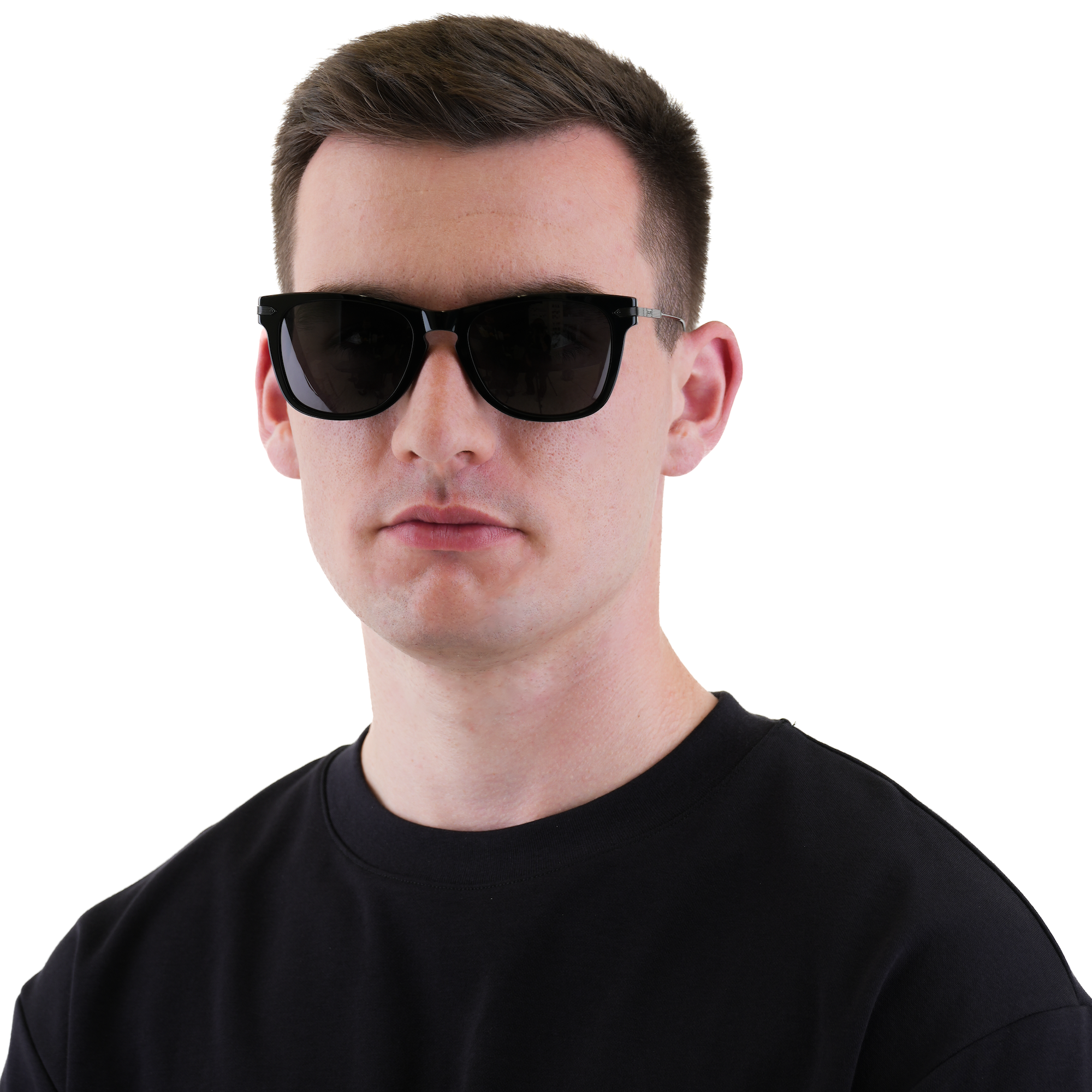 A man wearing black sunglasses and a black t-shirt, photographed against a solid white background.