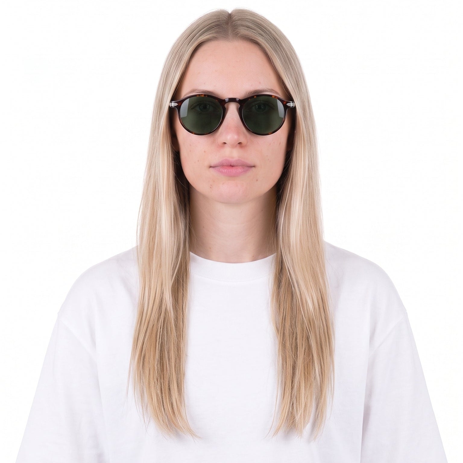 A woman with long blonde hair wearing a plain white short-sleeve t-shirt and dark sunglasses, photographed against a solid white background.